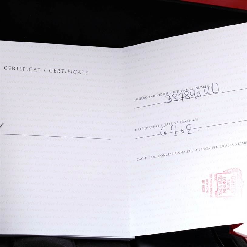 The image shows an open certificate booklet for the Cartier Roadster W62002V3 Men's Stainless Steel Black Dial W62002V3 Men's Stainless Steel Black Dial watch, displaying its individual number, purchase date, and dealer stamp.