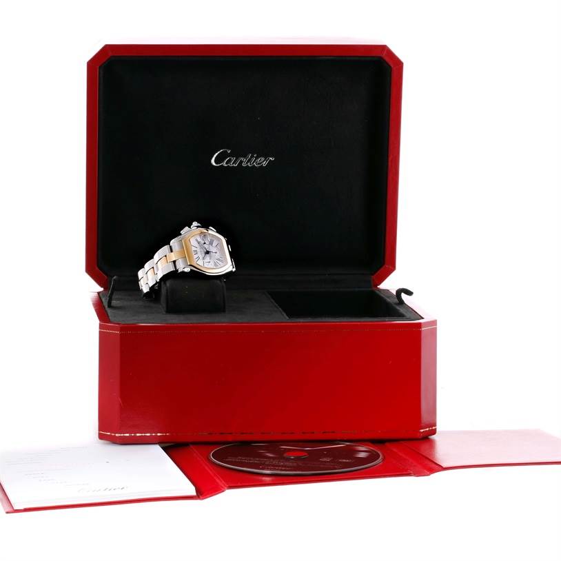 The Cartier Roadster W62027Z1 Men's Steel and Gold (two tone) Silver Dial W62027Z1 Men's Steel and Gold (two tone) Silver Dial watch is displayed at an angle in its opened red box, showing its face and part of the metal band.