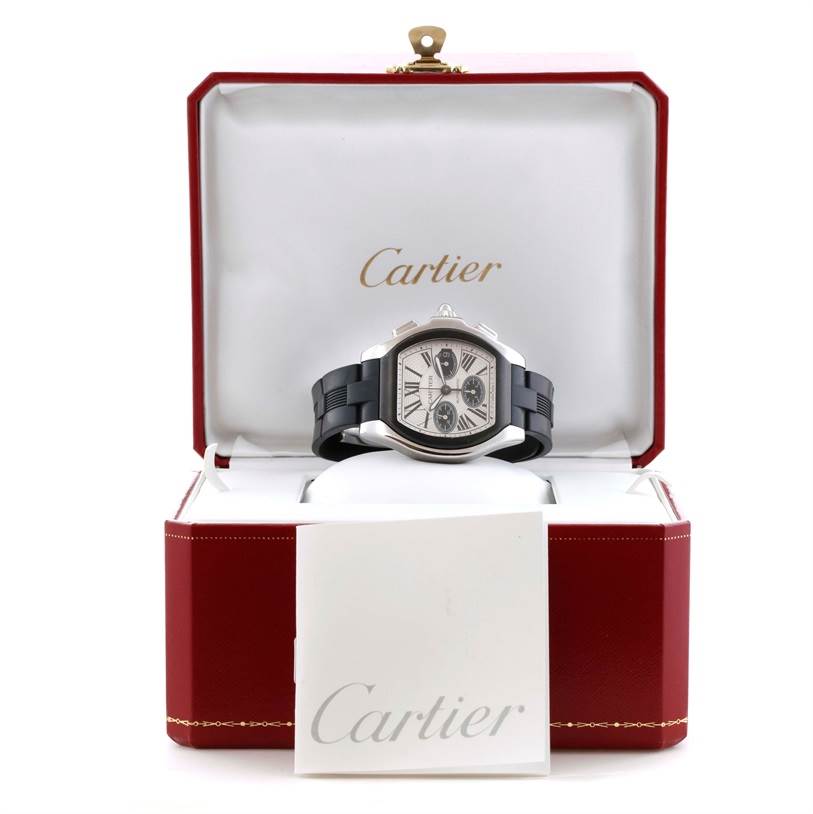 The Cartier Roadster W6206020 Men's Stainless Steel Silver Dial W6206020 Men's Stainless Steel Silver Dial watch is shown in its open box at a front angle, with a booklet placed in front.