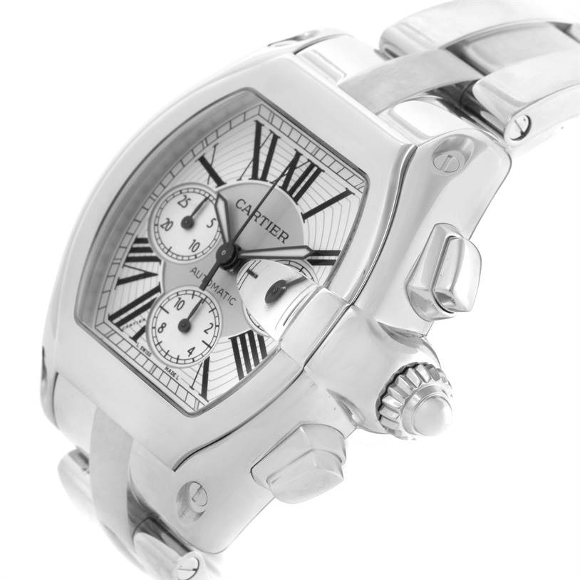 The image shows a close-up angled view of the Cartier Roadster W62019X6 Men's Stainless Steel Silver Dial W62019X6 Men's Stainless Steel Silver Dial watch, highlighting its dial, crown, and stainless steel bracelet.