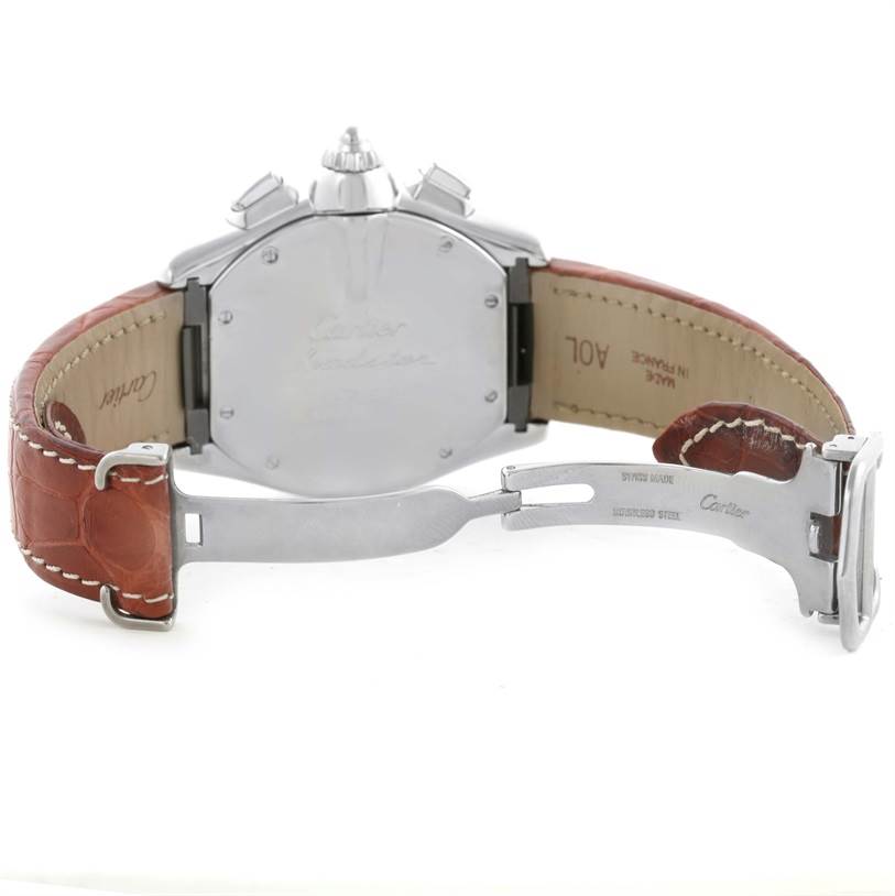 The image shows the back view of a Cartier Roadster W62019X6 Men's Stainless Steel Silver Dial W62019X6 Men's Stainless Steel Silver Dial watch with its clasp and leather strap opened.