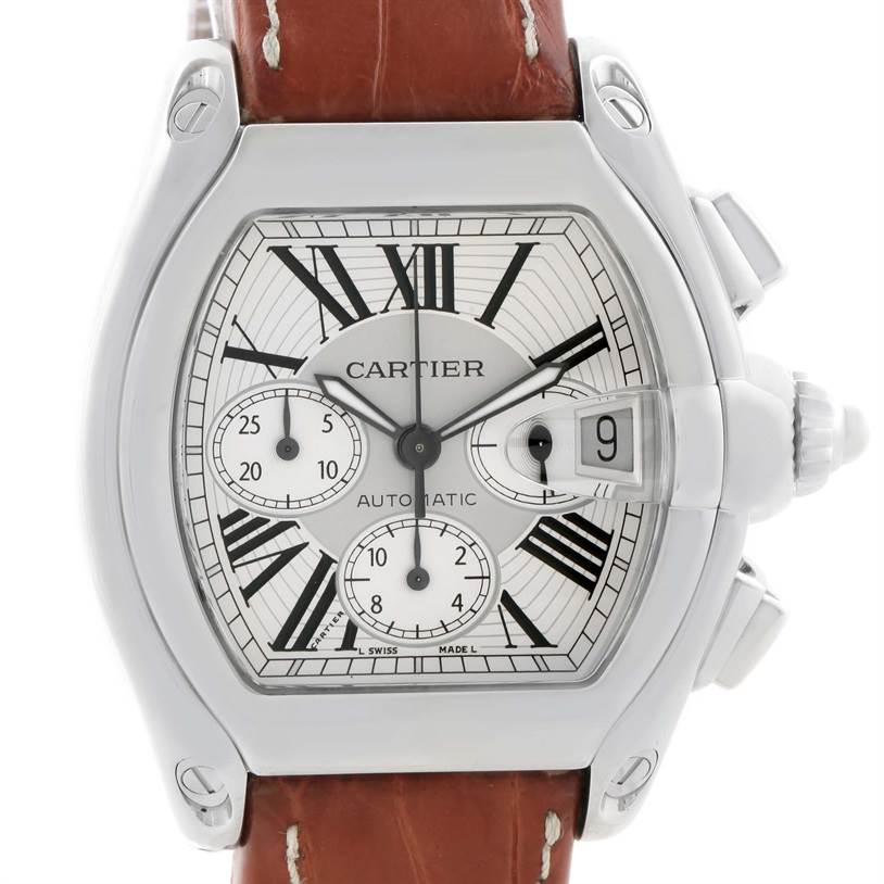The image shows a front view of the Cartier Roadster W62019X6 Men's Stainless Steel Silver Dial W62019X6 Men's Stainless Steel Silver Dial watch, featuring its face, side buttons, and brown leather strap.