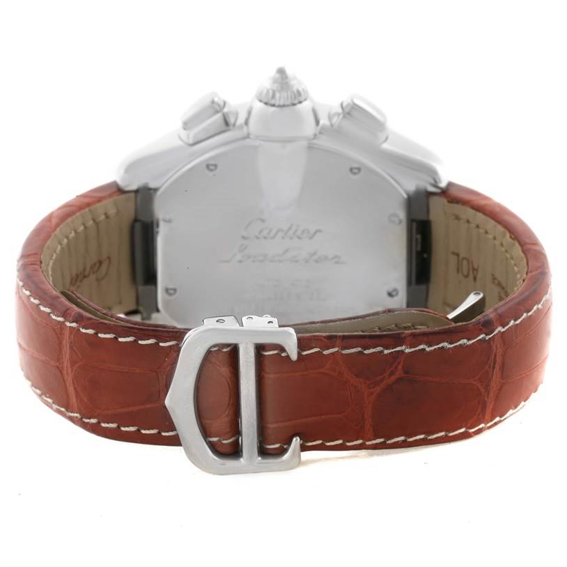 The image shows the back and clasp of a Cartier Roadster W62019X6 Men's Stainless Steel Silver Dial W62019X6 Men's Stainless Steel Silver Dial watch with a brown leather strap.