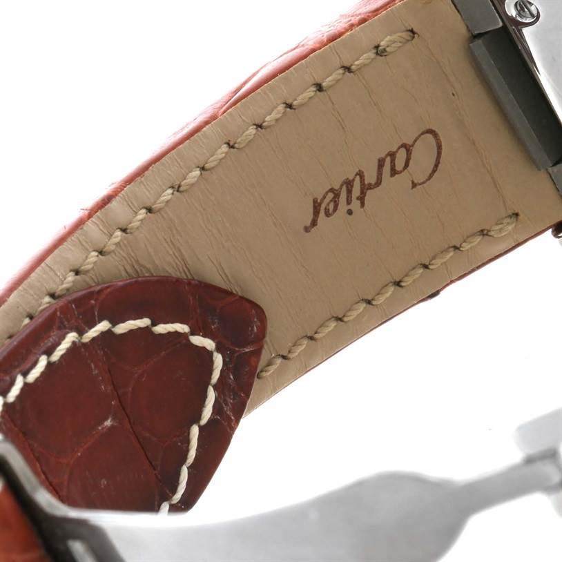 This image shows a close-up of the underside of the leather strap for a Cartier Roadster W62019X6 Men's Stainless Steel Silver Dial W62019X6 Men's Stainless Steel Silver Dial watch, highlighting the stitching and embossed brand logo.