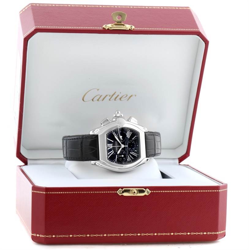 The Cartier Roadster W62020X6 Men's Stainless Steel Black Dial W62020X6 Men's Stainless Steel Black Dial watch is displayed front-on in its open red and white case.