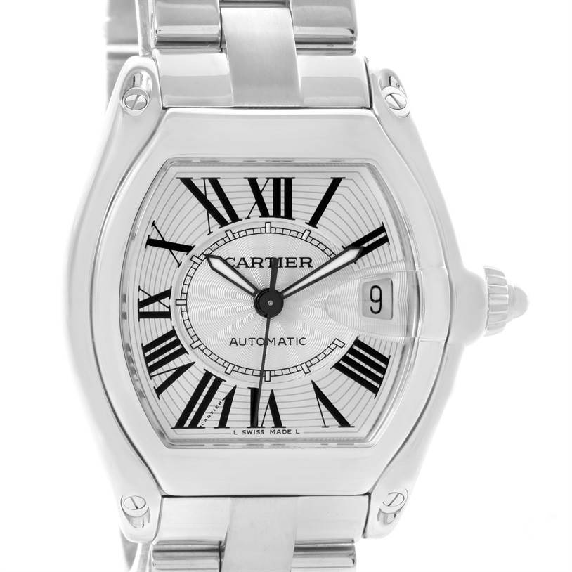 The image shows a close-up of the dial, crown, and part of the bracelet of the Cartier Roadster W62025V3 Men's Stainless Steel Silver Dial W62025V3 Men's Stainless Steel Silver Dial watch.