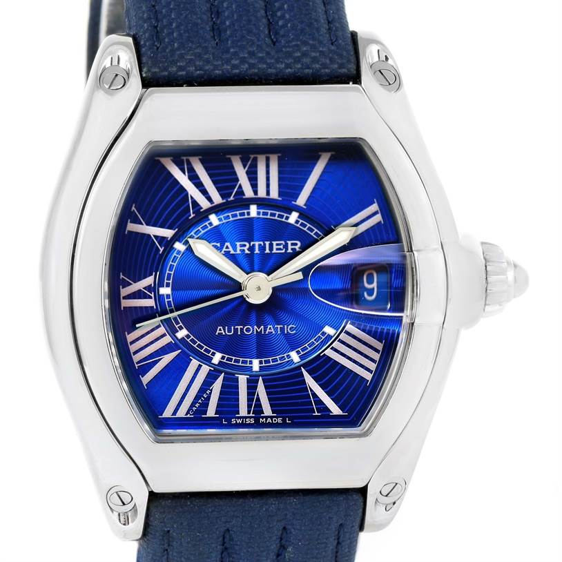 The image shows a frontal view of the Cartier Roadster W62048V3 Men's Stainless Steel Blue Dial W62048V3 Men's Stainless Steel Blue Dial watch, highlighting its blue dial and Roman numeral markers.