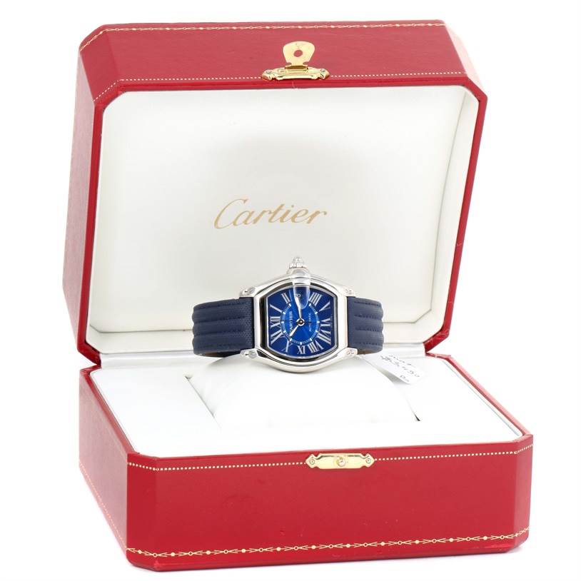 The Cartier Roadster W62048V3 Men's Stainless Steel Blue Dial W62048V3 Men's Stainless Steel Blue Dial watch is displayed front-facing in an open red and white Cartier case.