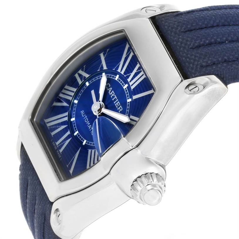 The image shows a side view of the Cartier Roadster W62048V3 Men's Stainless Steel Blue Dial W62048V3 Men's Stainless Steel Blue Dial watch, highlighting the crown, case, and part of the blue strap.
