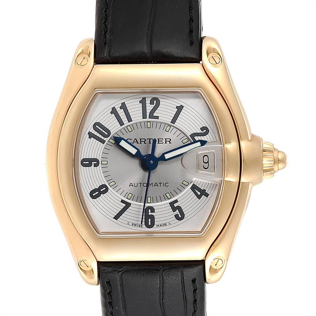 The image shows a frontal view of the Cartier Roadster W62005V2 Men's Yellow Gold Silver Dial W62005V2 Men's Yellow Gold Silver Dial watch, highlighting its dial, hands, date window, and leather strap.