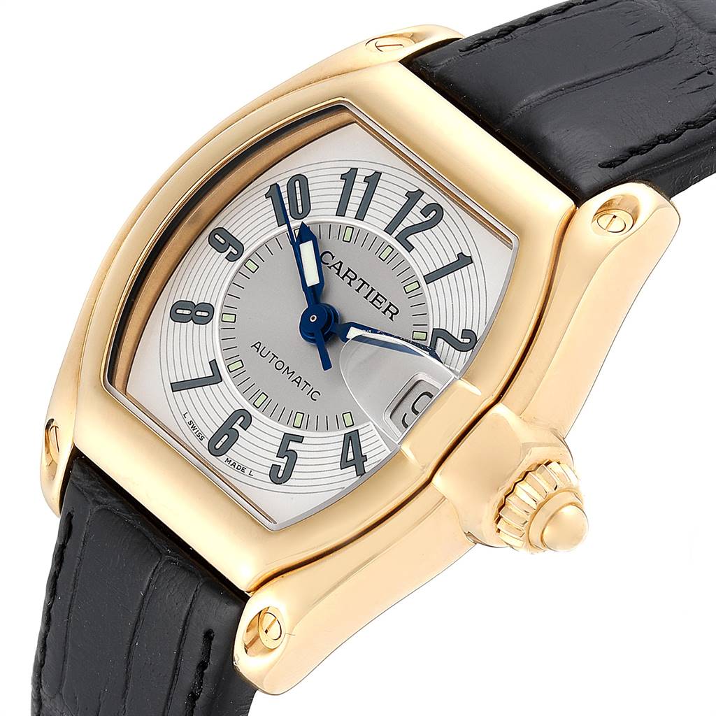 The Cartier Roadster W62005V2 Men's Yellow Gold Silver Dial W62005V2 Men's Yellow Gold Silver Dial watch is shown at a slight angle, displaying its face, crown, and a portion of the strap.