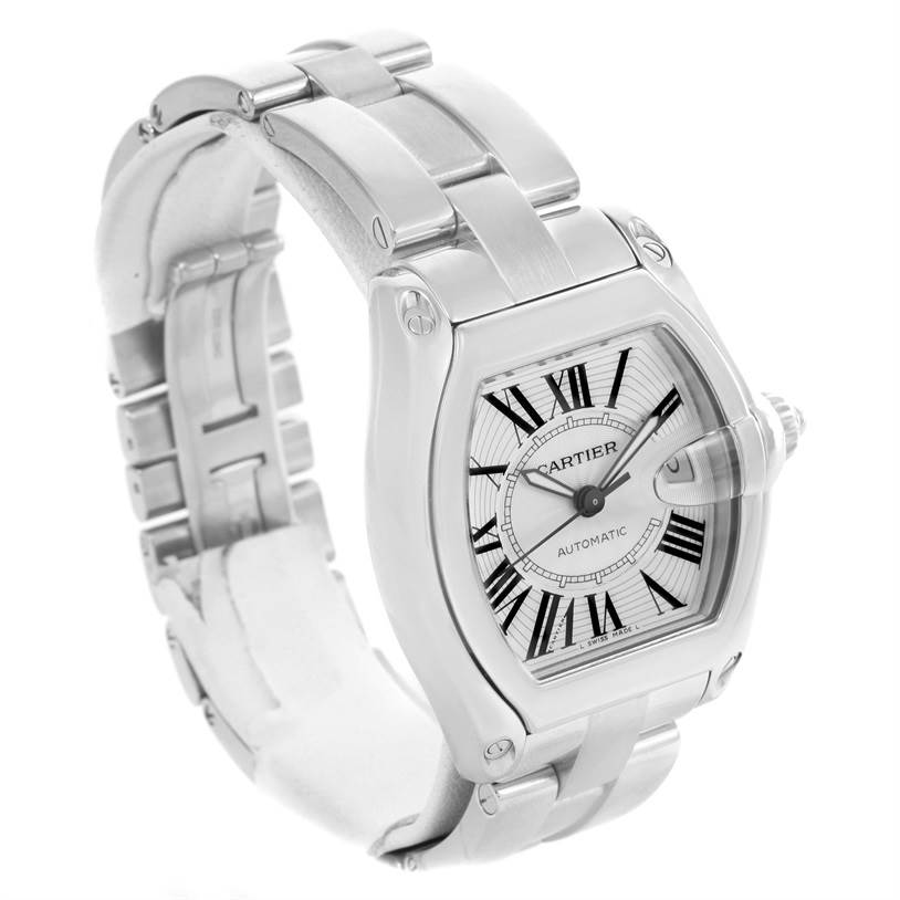 The image shows a Cartier Roadster W62025V3 Men's Stainless Steel Silver Dial W62025V3 Men's Stainless Steel Silver Dial watch at a 3/4 angle, highlighting its face, bracelet, and side crown.