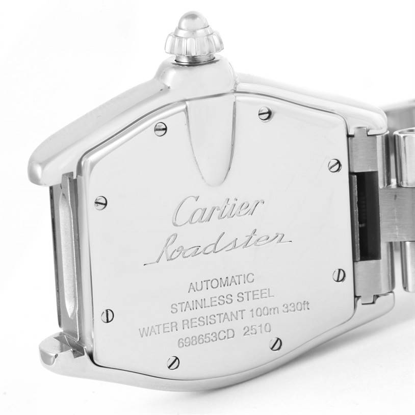 The image shows the back case and crown of a Cartier Roadster W62025V3 Men's Stainless Steel Silver Dial W62025V3 Men's Stainless Steel Silver Dial watch, displaying its engravings and part of the bracelet.