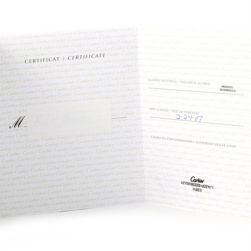 This image shows an open certificate of authenticity for the Cartier Roadster W62025V3 Men's Stainless Steel Silver Dial W62025V3 Men's Stainless Steel Silver Dial model, displaying dealer stamp and purchase date.