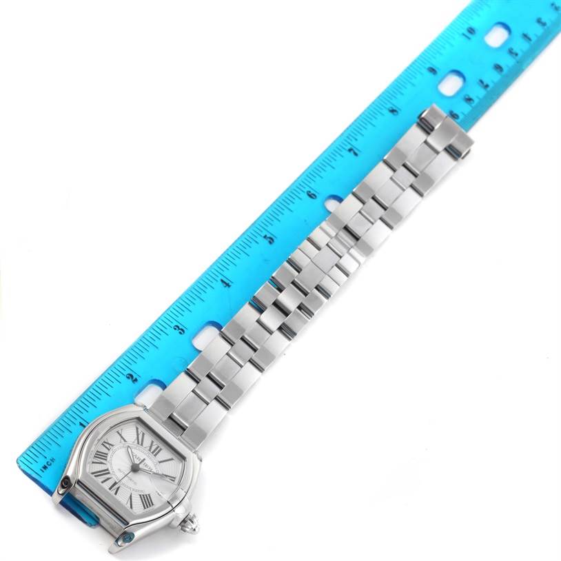 The Cartier Roadster W62025V3 Men
s Stainless Steel Silver Dial W62025V3 Men
s Stainless Steel Silver Dial watch is shown from a top-down angle with its face and bracelet aligned with a ruler for measurement.