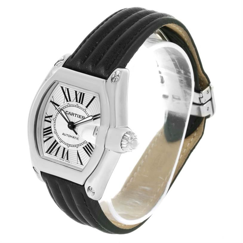 The image shows a Cartier Roadster W62025V3 Men's Stainless Steel Silver Dial W62025V3 Men's Stainless Steel Silver Dial watch at an angle highlighting the face, crown, and part of its leather strap.