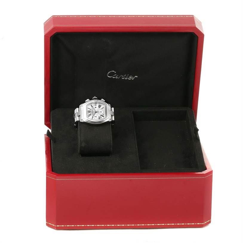 The Cartier Roadster W62019X6 Men
s Stainless Steel Silver Dial W62019X6 Men
s Stainless Steel Silver Dial watch is shown from a front angle in a red case with the Cartier logo visible.