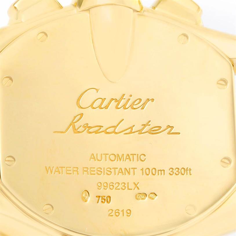 The image shows the engraved back of a Cartier Roadster W62021Y2 Men's Yellow Gold Silver Dial W62021Y2 Men's Yellow Gold Silver Dial watch, including details such as the model, water resistance, and serial numbers.