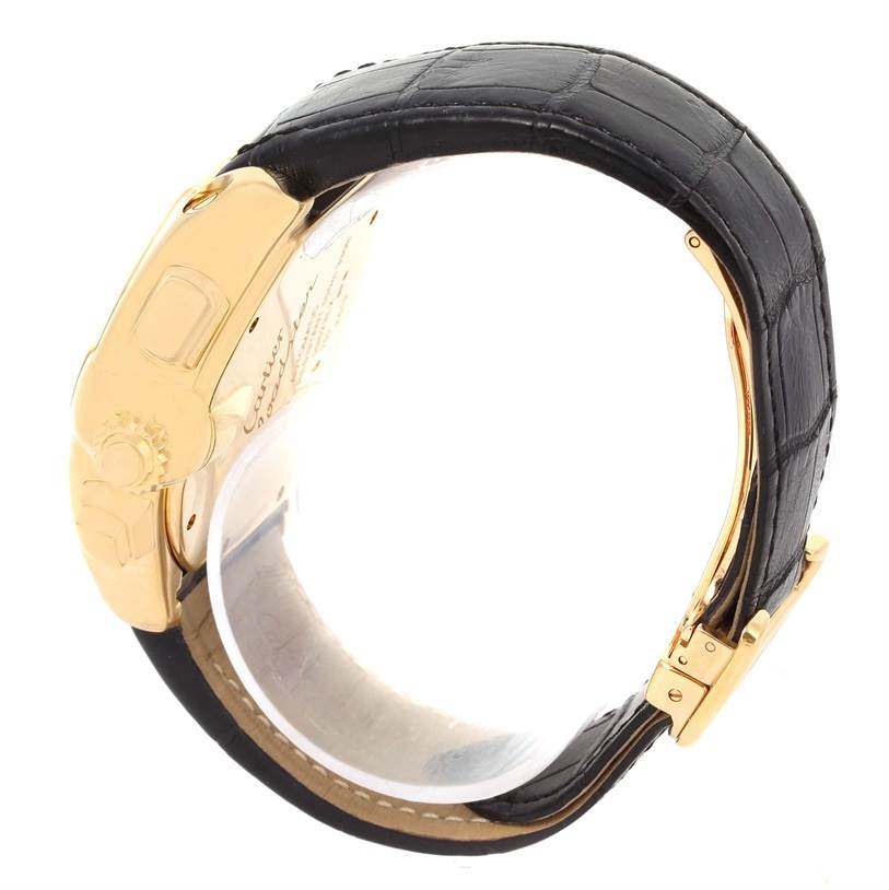 The image shows a side view of the Cartier Roadster W62021Y2 Men's Yellow Gold Silver Dial W62021Y2 Men's Yellow Gold Silver Dial watch, focusing on its gold-tone case, crown, and black leather strap.