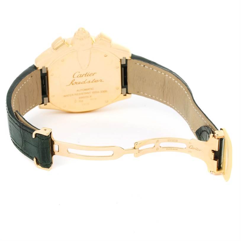 The image shows the back view of a Cartier Roadster W62021Y2 Men's Yellow Gold Silver Dial W62021Y2 Men's Yellow Gold Silver Dial watch with its strap and clasp open.