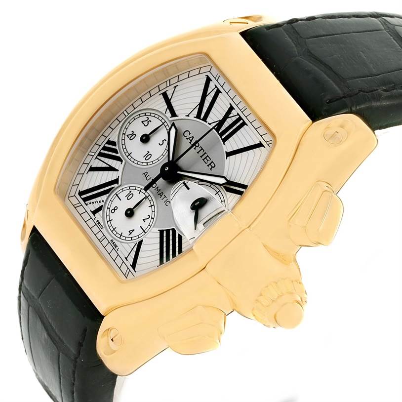 The Cartier Roadster W62021Y2 Men's Yellow Gold Silver Dial W62021Y2 Men's Yellow Gold Silver Dial watch is shown from a side angle, highlighting the dial, crown, and part of the leather strap.