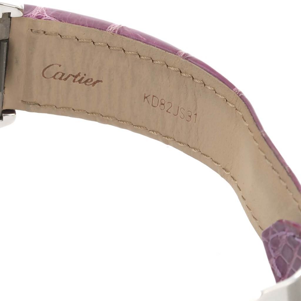 The image shows the inner side of the strap of a Cartier Roadster W62019X6 Men's Stainless Steel Silver Dial W62019X6 Men's Stainless Steel Silver Dial watch, displaying the brand name and a serial number.
