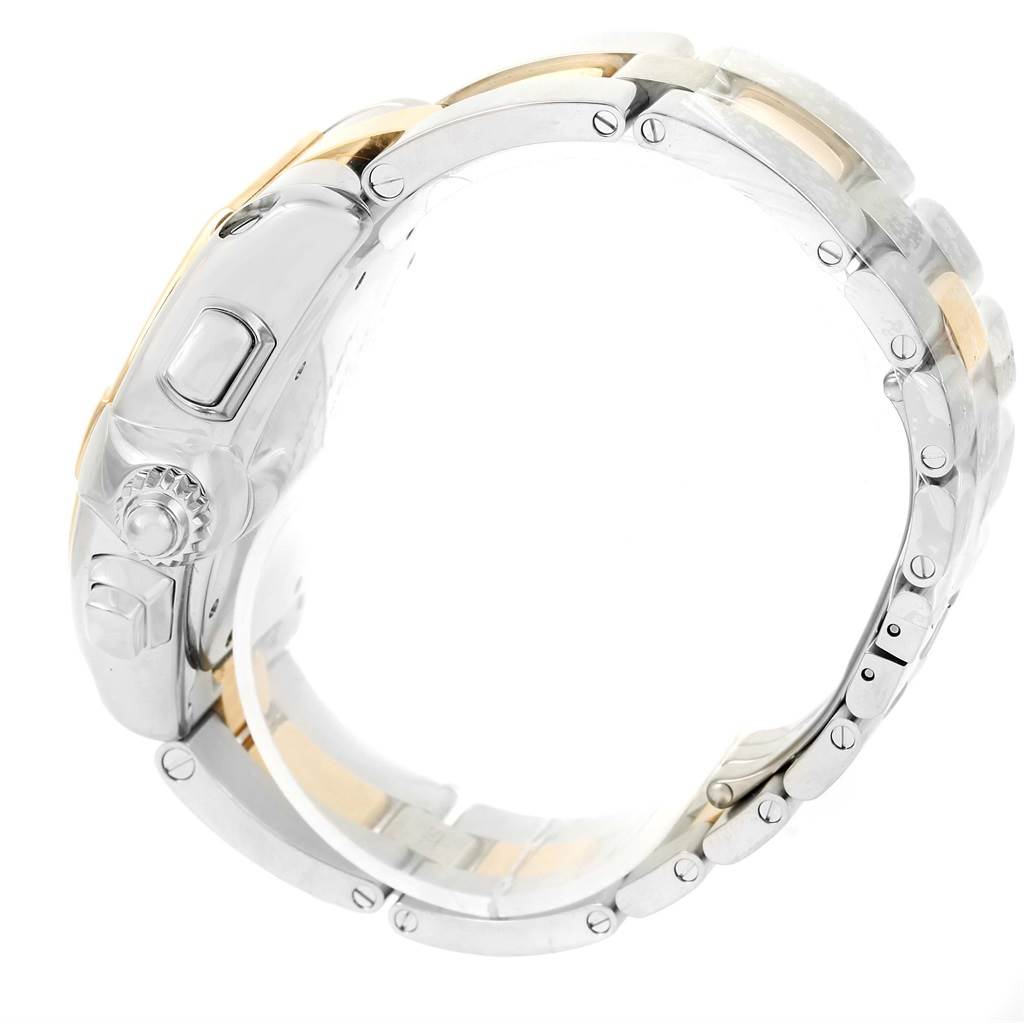 The image shows the side view of a Cartier Roadster W62027Z1 Men's Steel and Gold (two tone) Silver Dial W62027Z1 Men's Steel and Gold (two tone) Silver Dial watch focusing on the crown, lugs, and bracelet.