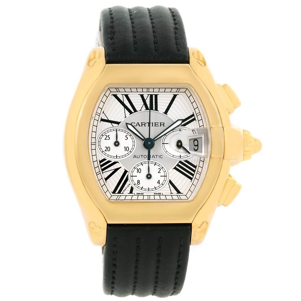 The Cartier Roadster W62021Y2 Men's Yellow Gold Silver Dial W62021Y2 Men's Yellow Gold Silver Dial watch is shown from a front angle, highlighting its face, black leather strap, and gold casing.