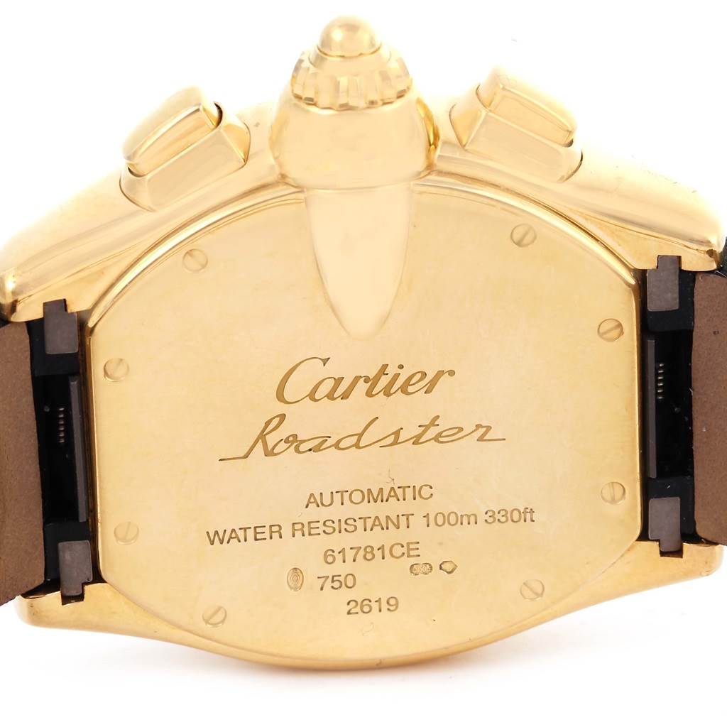The image shows the back of a Cartier Roadster W62021Y2 Men's Yellow Gold Silver Dial W62021Y2 Men's Yellow Gold Silver Dial watch, highlighting the engravings and part of the strap attachment.