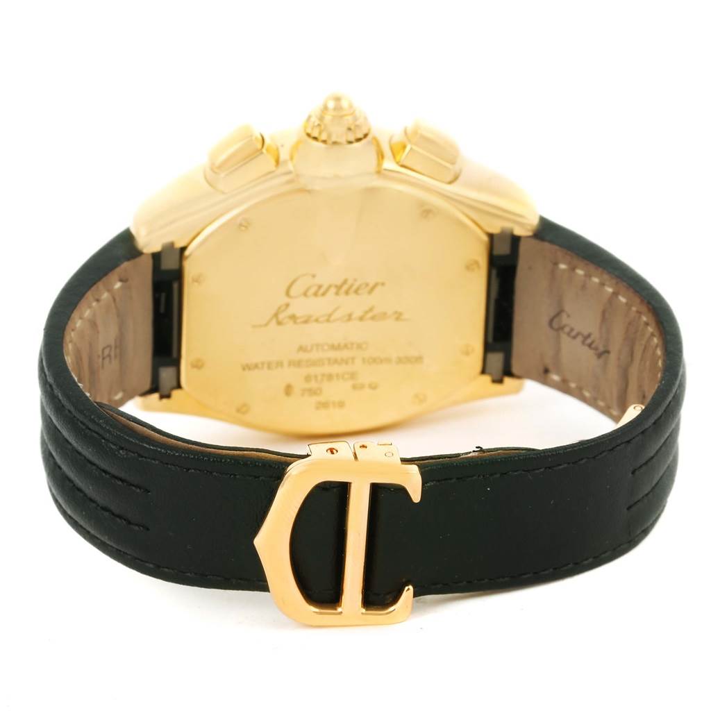 The image shows the back view of the Cartier Roadster W62021Y2 Men's Yellow Gold Silver Dial W62021Y2 Men's Yellow Gold Silver Dial watch with details of the case back and the clasp.