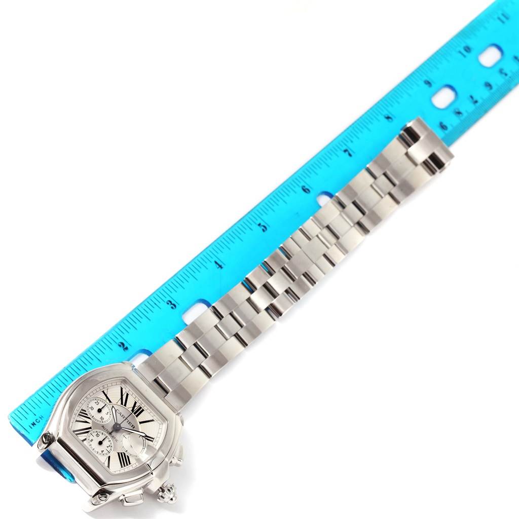 The Cartier Roadster W62019X6 Men's Stainless Steel Silver Dial W62019X6 Men's Stainless Steel Silver Dial watch is shown from a top view with a blue ruler measuring its bracelet.