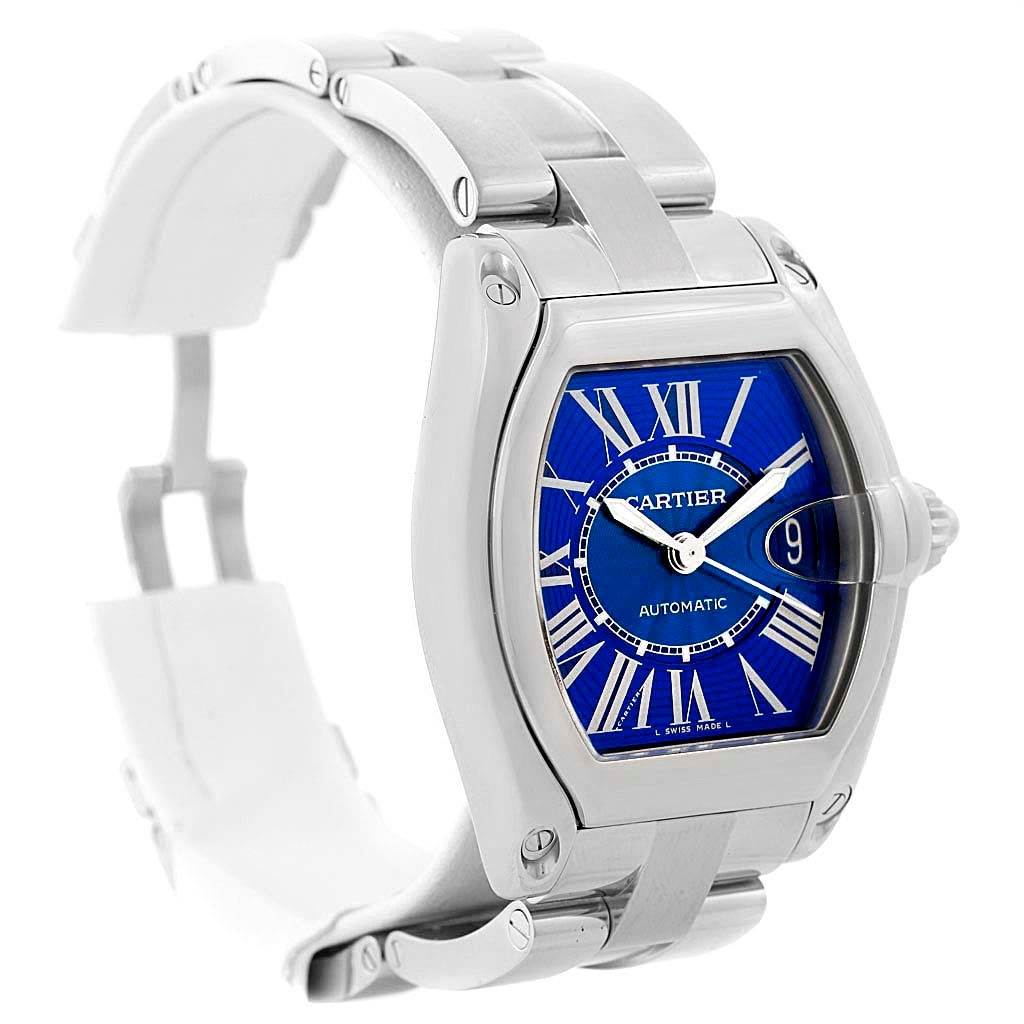 The image shows the Cartier Roadster W62048V3 Men
s Stainless Steel Blue Dial W62048V3 Men
s Stainless Steel Blue Dial watch from a slightly angled front view, displaying the band, case, dial, and crown.