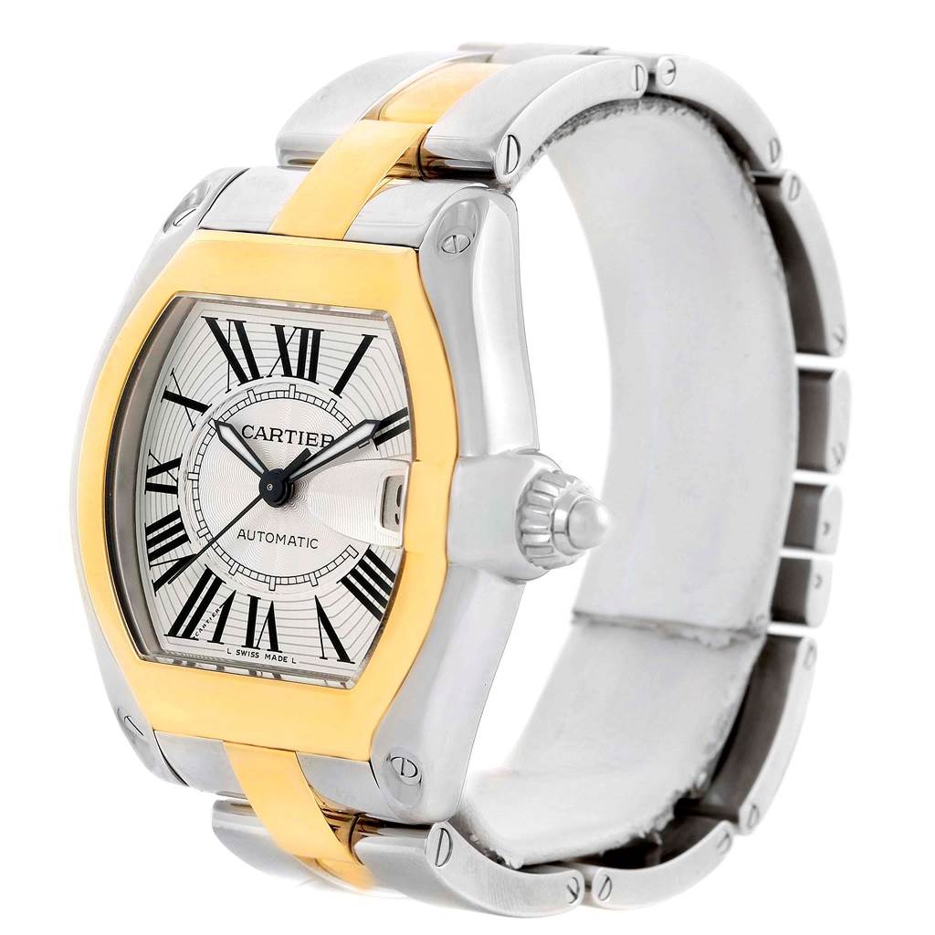 This Cartier Roadster W62031Y4 Men's Steel and Gold (two tone) Silver Dial W62031Y4 Men's Steel and Gold (two tone) Silver Dial watch is shown at a three-quarter angle, highlighting its dial, crown, bezel, and part of the bracelet.
