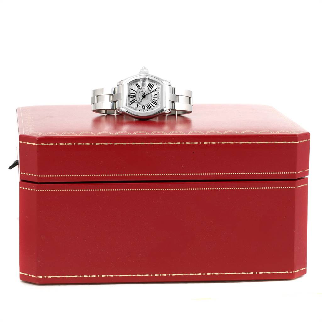 The Cartier Roadster W62032X6 Men's Stainless Steel Silver Dial W62032X6 Men's Stainless Steel Silver Dial watch is displayed face-up on a closed red box.