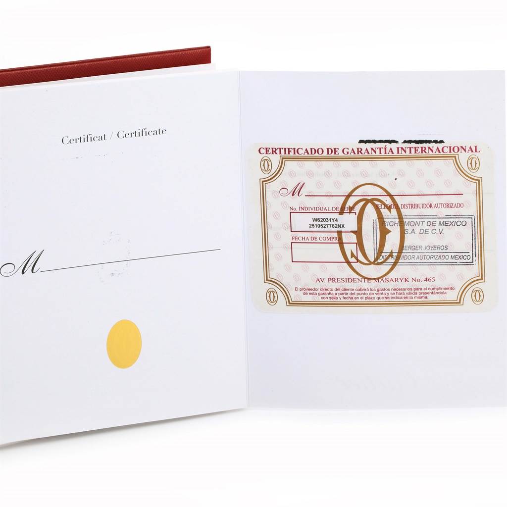 This image shows the warranty card and certificate for a Cartier Roadster W62031Y4 Men's Steel and Gold (two tone) Black Dial W62031Y4 Men's Steel and Gold (two tone) Black Dial watch, displayed at an open angle.
