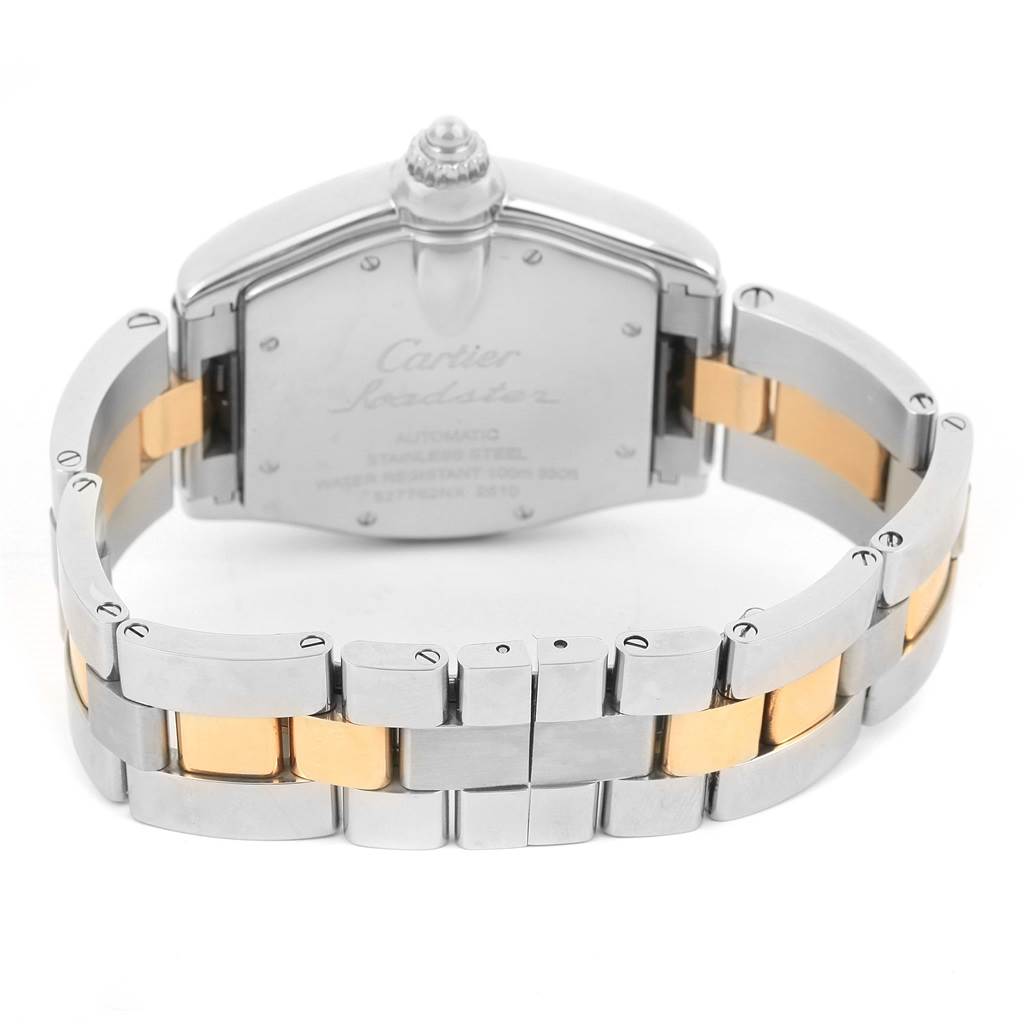 The image shows the backside of a Cartier Roadster W62031Y4 Men's Steel and Gold (two tone) Black Dial W62031Y4 Men's Steel and Gold (two tone) Black Dial watch, highlighting the back case, crown, and two-tone metal bracelet.