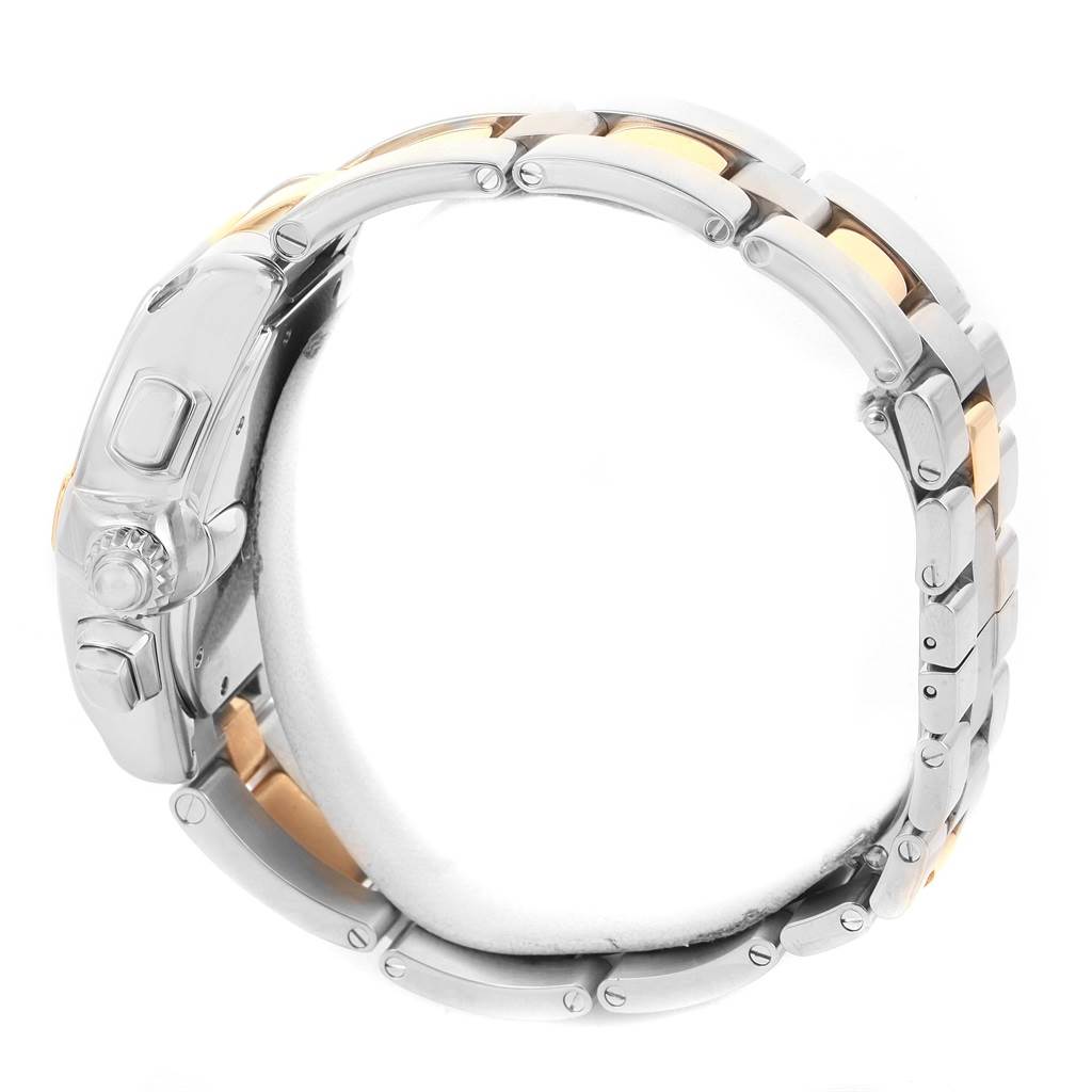 The image shows a side profile of the Cartier Roadster W62027Z1 Men's Steel and Gold (two tone) Silver Dial W62027Z1 Men's Steel and Gold (two tone) Silver Dial watch, highlighting the side buttons, crown, and part of the bracelet.