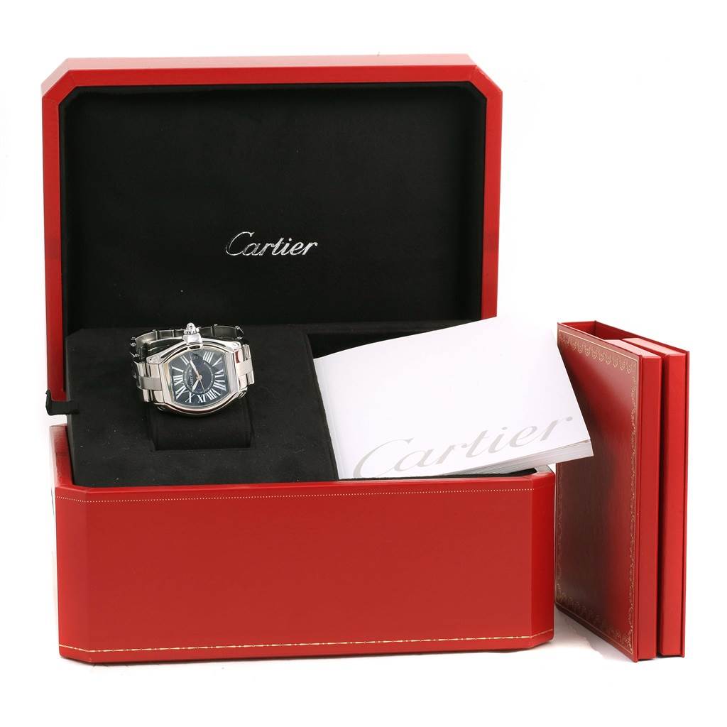 The Cartier Roadster W6206012 Men
s Stainless Steel Blue Dial W6206012 Men
s Stainless Steel Blue Dial watch is shown from the front, displayed in its red box with a booklet beside it.