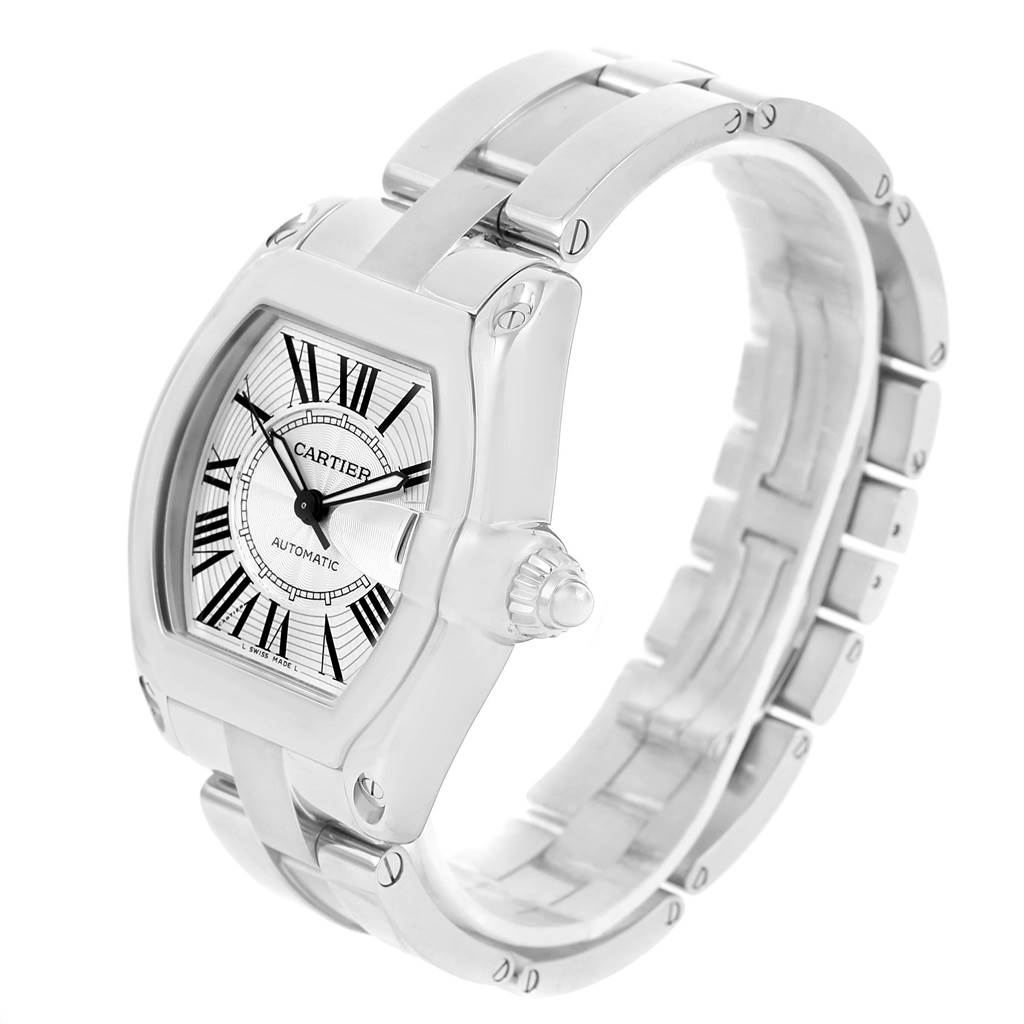 This Roadster model by Cartier is shown at an angled view, displaying its dial, crown, and stainless steel bracelet.