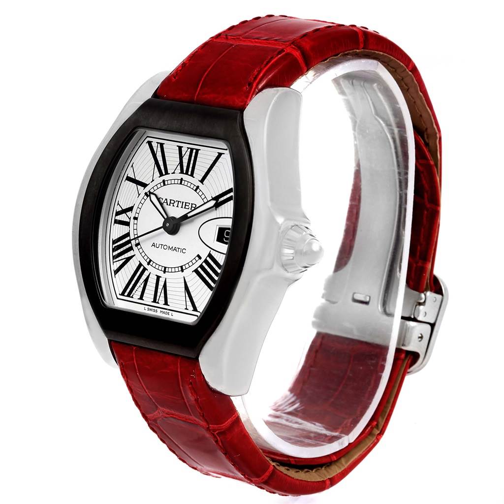 The image shows a Cartier Roadster W6206018 Men
s Stainless Steel Silver Dial W6206018 Men
s Stainless Steel Silver Dial watch from an angle displaying the face, crown, and red leather strap.