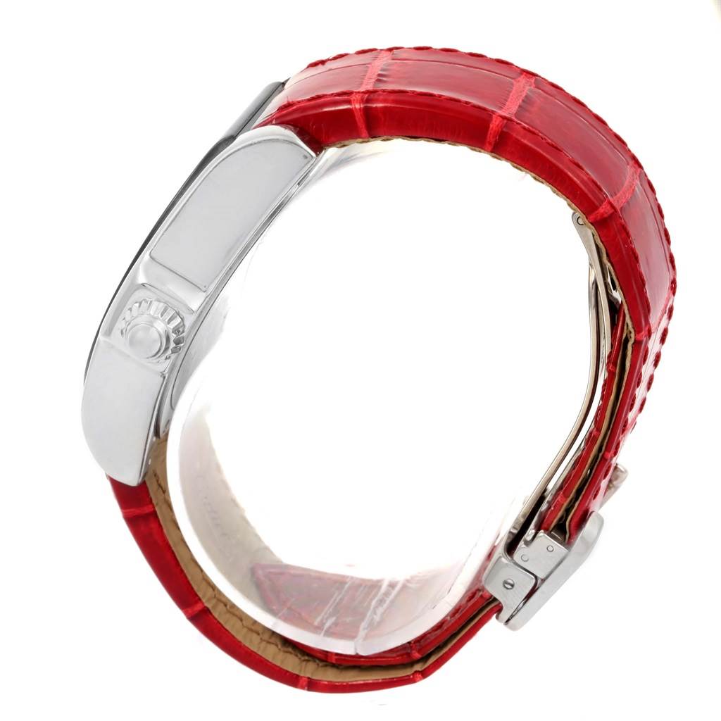 This image shows a side view of a Cartier Roadster W6206018 Men
s Stainless Steel Silver Dial W6206018 Men
s Stainless Steel Silver Dial watch, highlighting its distinctive red leather strap and crown.