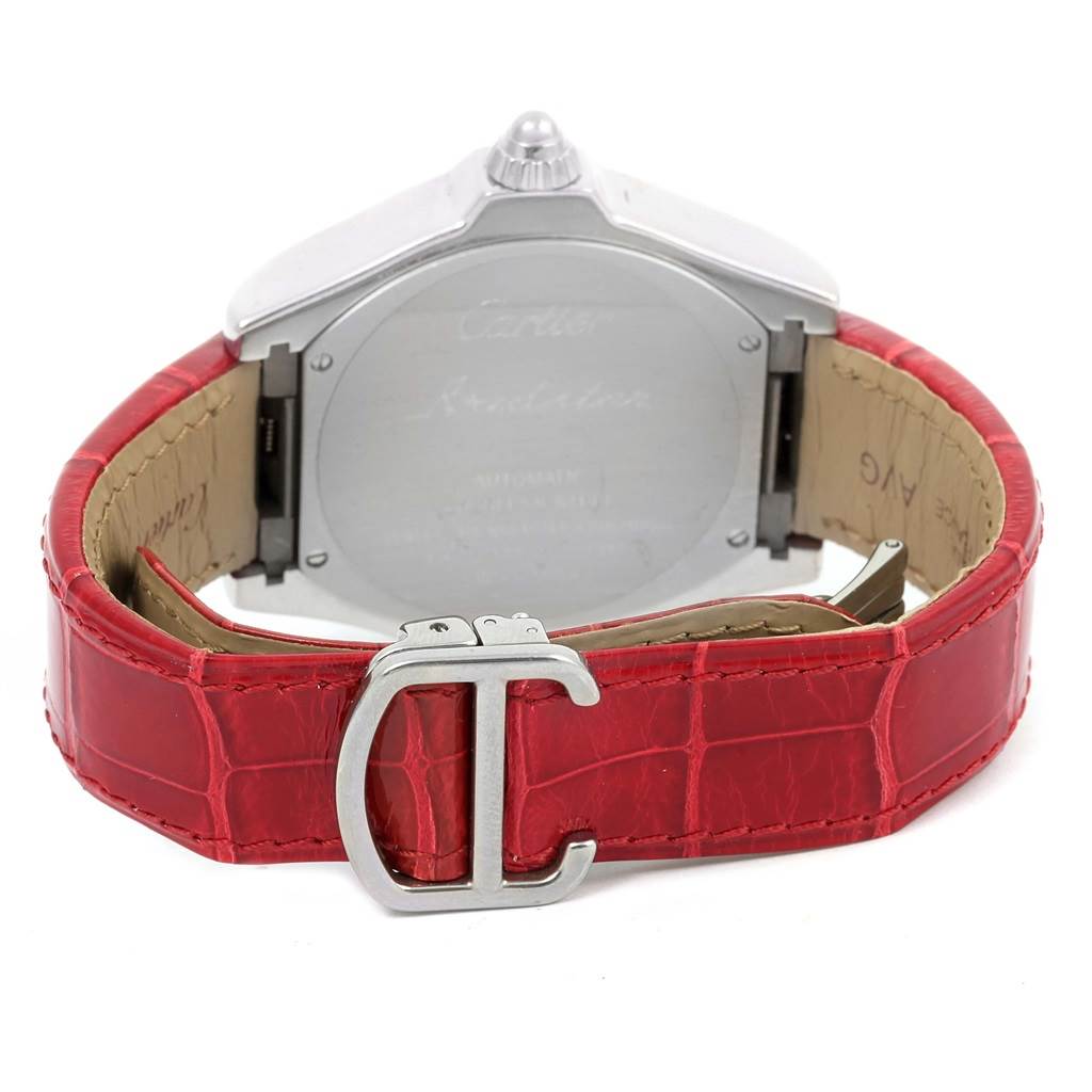 The image shows the back view of a Cartier Roadster W6206018 Men
s Stainless Steel Silver Dial W6206018 Men
s Stainless Steel Silver Dial watch, including the case back and red leather strap with a distinctive clasp.