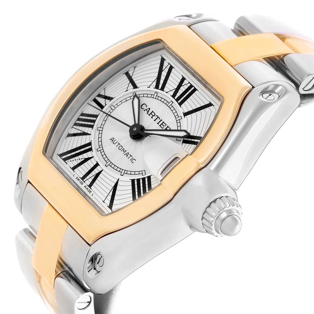 The image shows a close-up angle of the dial, bezel, crown, and part of the bracelet of a Cartier Roadster W62031Y4 Men's Steel and Gold (two tone) Silver Dial W62031Y4 Men's Steel and Gold (two tone) Silver Dial watch.