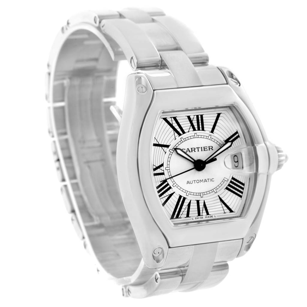 The image shows a Cartier Roadster W62025V3 Men
s Stainless Steel Silver Dial W62025V3 Men
s Stainless Steel Silver Dial watch at a three-quarter angle, featuring its face, dial, bezel, and part of the bracelet.