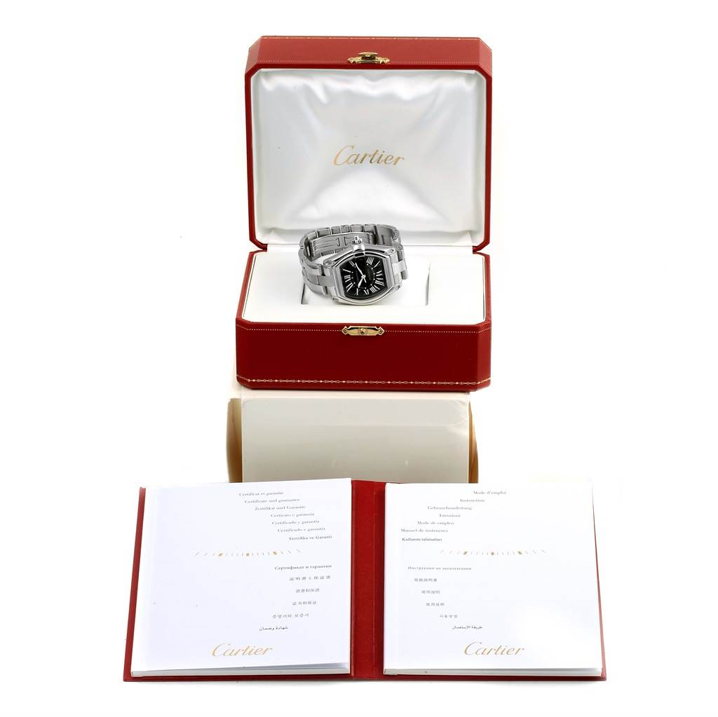 The image shows a Cartier Roadster W62041V3 Men's Stainless Steel Black Dial W62041V3 Men's Stainless Steel Black Dial watch angled front-on in its opened red box with accompanying documentation.