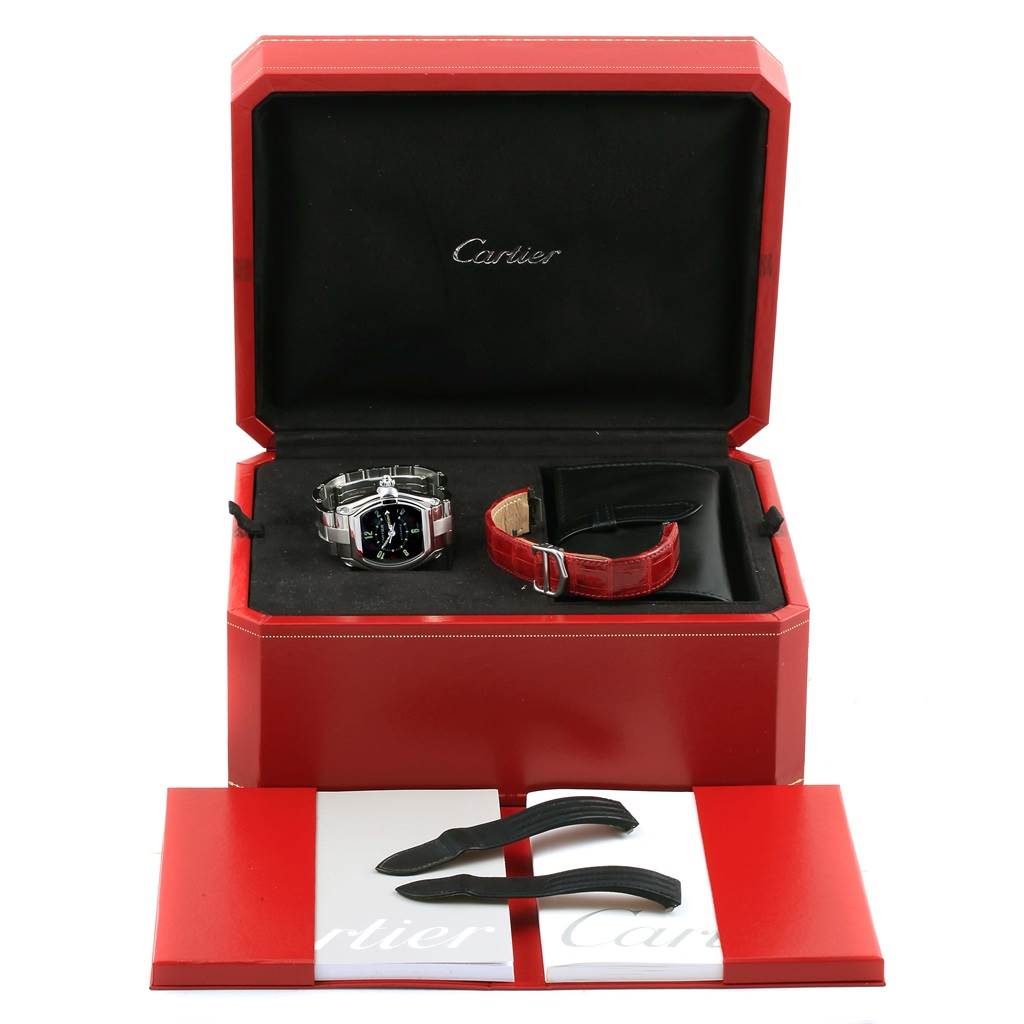 The image shows a Cartier Roadster W62002V3 Men's Stainless Steel Black Dial W62002V3 Men's Stainless Steel Black Dial watch with its original packaging, extra strap, tools, and user manual.