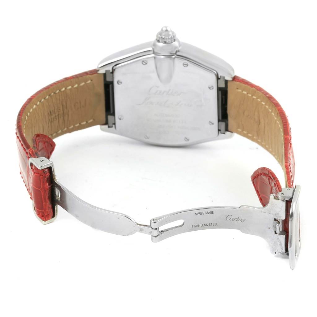 The image shows the back case and clasp of a Cartier Roadster W62002V3 Men's Stainless Steel Black Dial W62002V3 Men's Stainless Steel Black Dial watch with a red leather strap and stainless steel clasp.