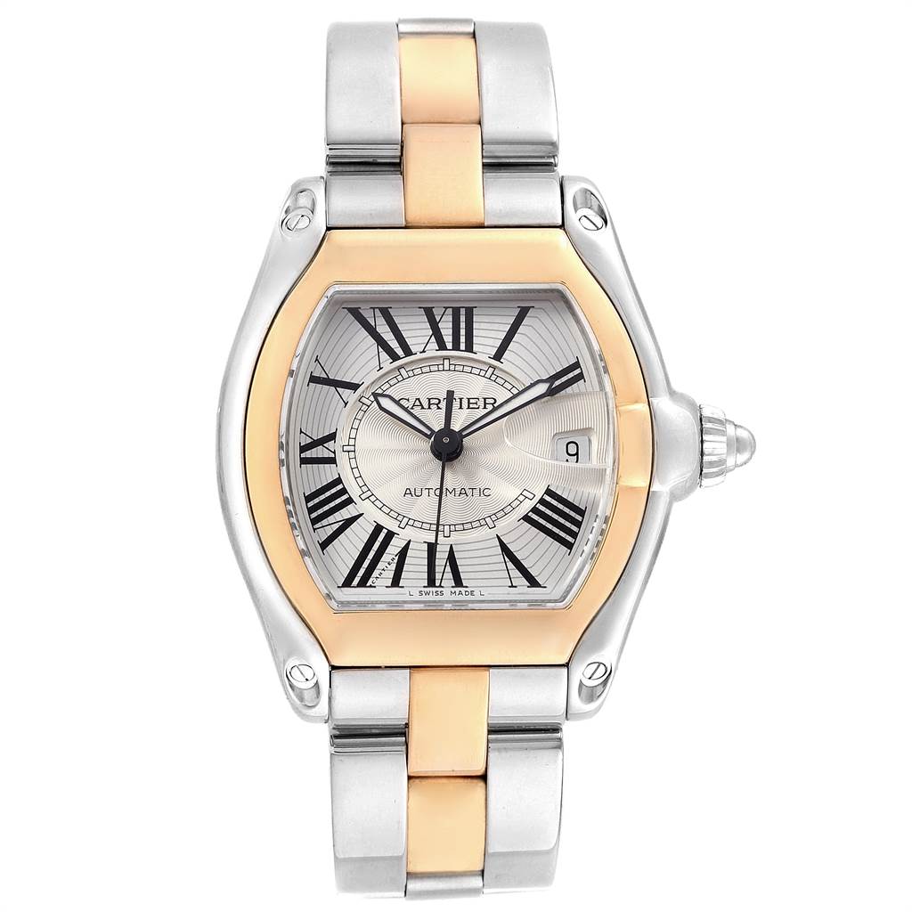 The image shows a Cartier Roadster W62031Y4 Men's Steel and Gold (two tone) Silver Dial W62031Y4 Men's Steel and Gold (two tone) Silver Dial watch, featuring a two-tone band, Roman numeral dial, and date window, viewed from the front.