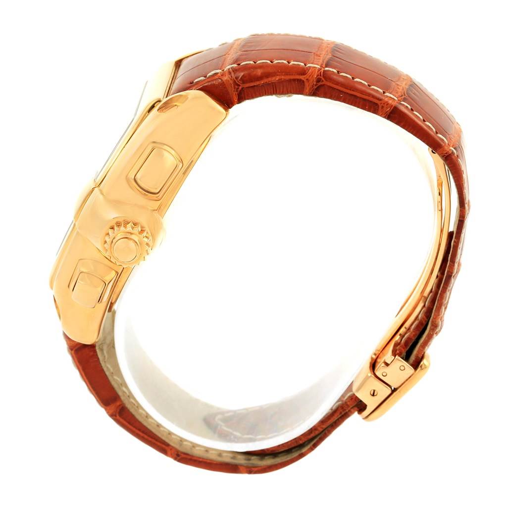 The image shows a Cartier Roadster W62021Y3 Men
s Yellow Gold Champagne Dial W62021Y3 Men
s Yellow Gold Champagne Dial watch, focusing on its side profile, crown, and brown leather strap with a clasp.