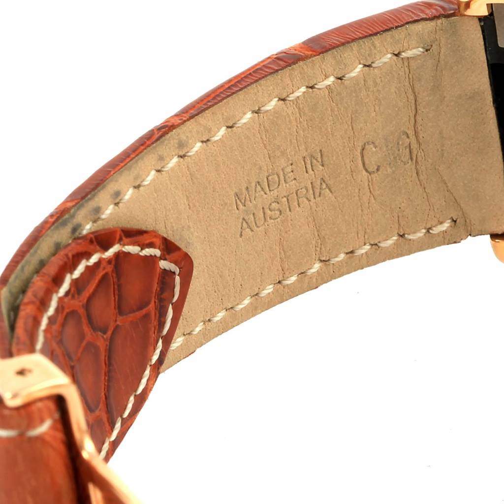 The image shows a close-up of the leather strap for the Cartier Roadster W62021Y3 Men
s Yellow Gold Champagne Dial W62021Y3 Men
s Yellow Gold Champagne Dial watch, highlighting the stitching and "Made in Austria" text.